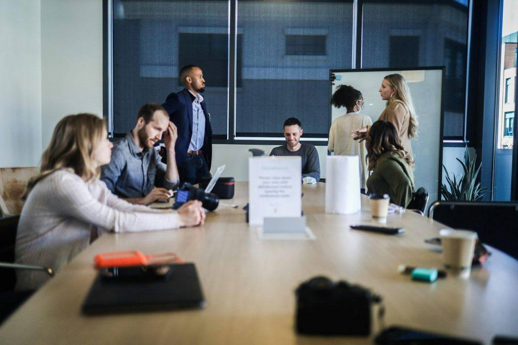 Agency team meeting around a table to review client strategy