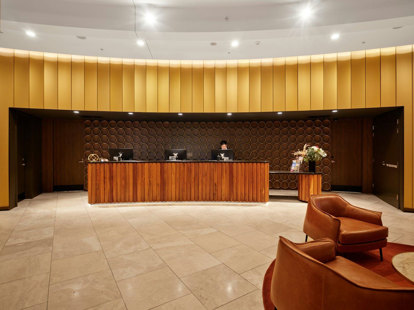 Hotel reception desk in a wood-paneled lobby